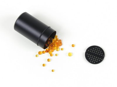 The whole desiccant container can be baked to dry the silica-gel inside or its content can be poured out after unscrewing the perforated internal cap and baked separately