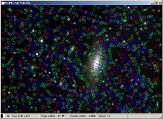 Image of NGC7331 with found stars (green circles), matching catalog stars (red circles) and blue lines showing sound relations